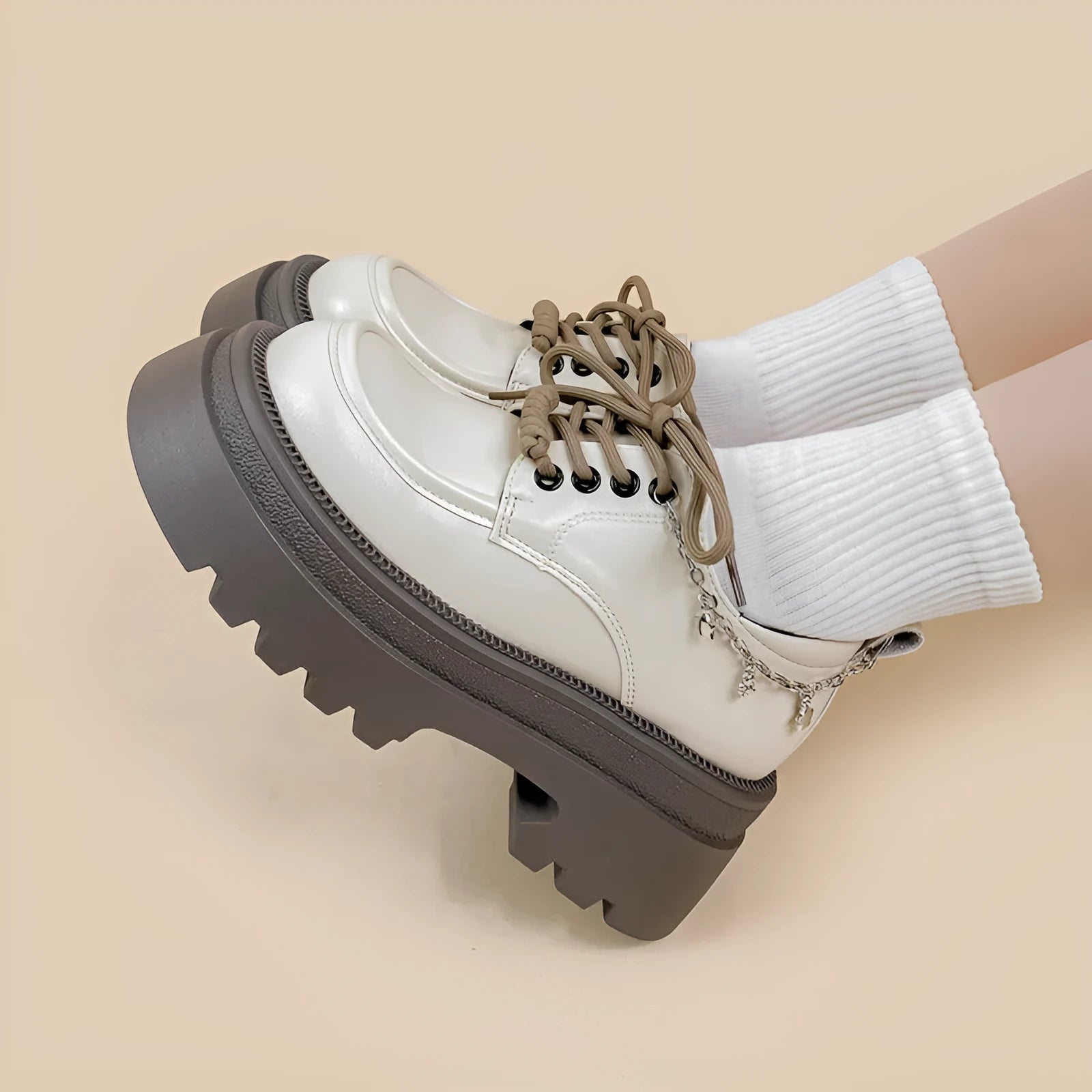 White women's Mary Jane platform shoes with chunky heel and front lace-up.