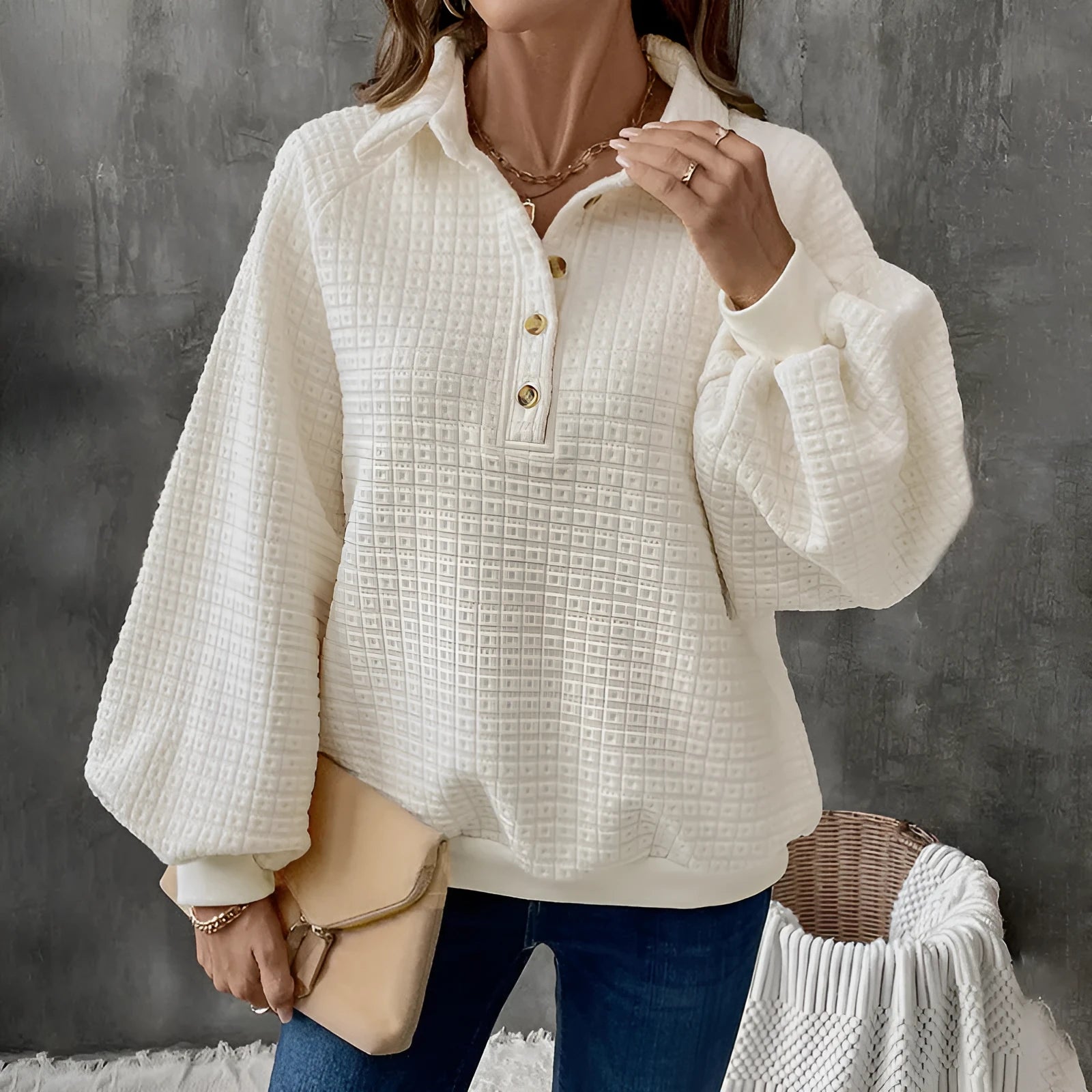 Women's solid colour polo collar sweater with long sleeves in a textured knit.
