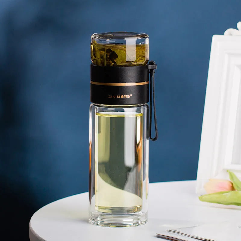 Glass water bottle with tea infuser filter showing double wall construction and portable rope