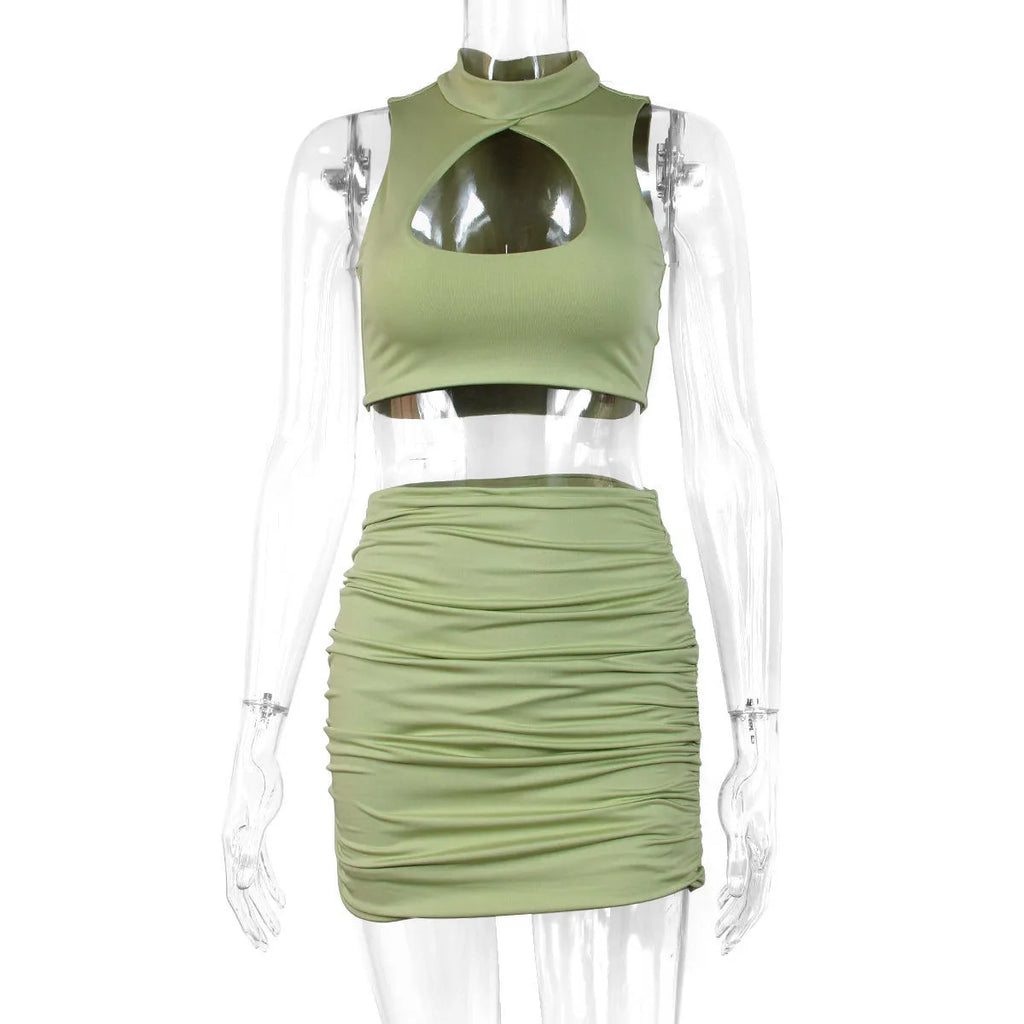Women's light purple elastic polyester two-piece set with hollow vest top and matching hip skirt