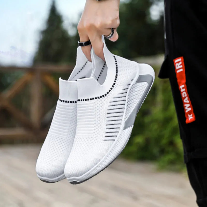 Men's low-cut sneakers with striped Flyknit upper, mesh lining, and flat plastic sole.