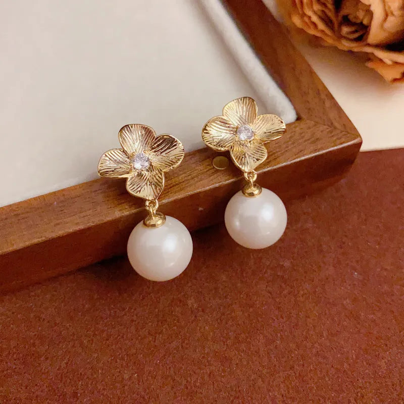 Women's gold plated copper floral drop earrings with faux pearl and metal petals simple style