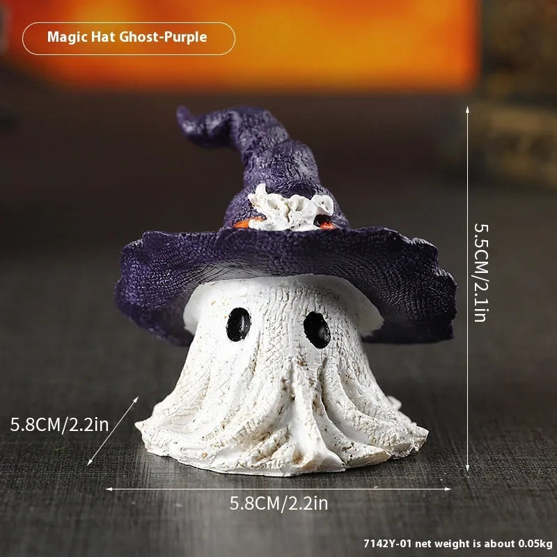 Close-up of a detailed black and a purple resin wizard hat ornament for holiday decoration.