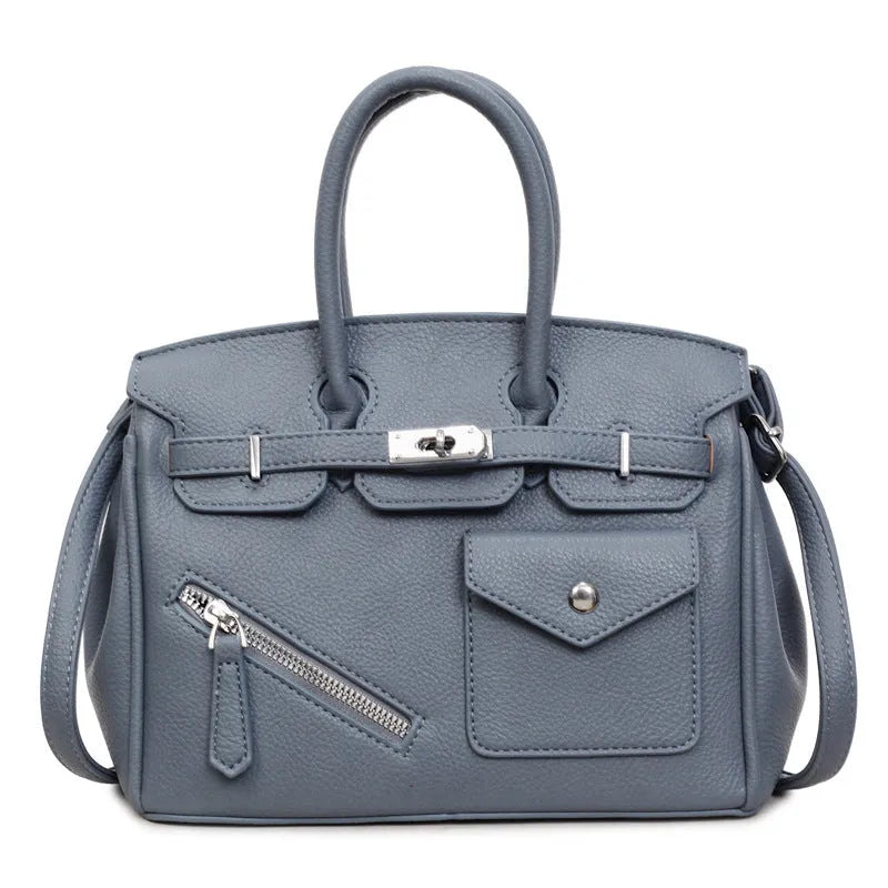 PU leather retro cross-body bag in solid colour with stitching, lock detail, and horizontal square shape
