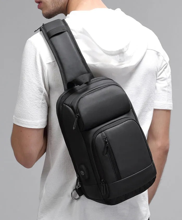 Black medium outdoor leisure shoulder bag showing square shape and single air cushion strap