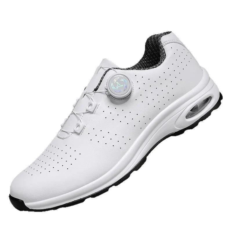 Black and white low-top mesh casual tennis shoes with cross shoulder straps and a flat sole.