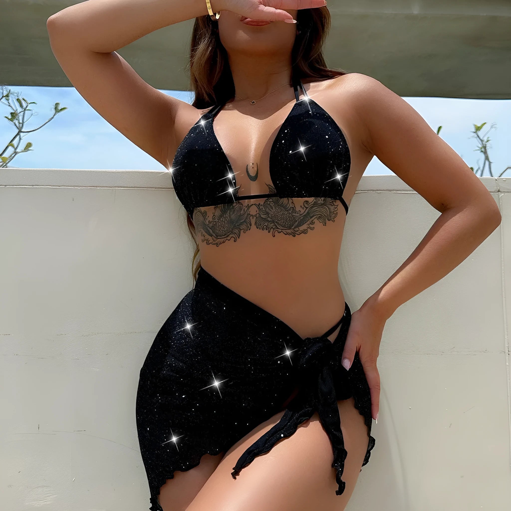 Black three-piece bikini swimsuit set with top and shorts on mannequin