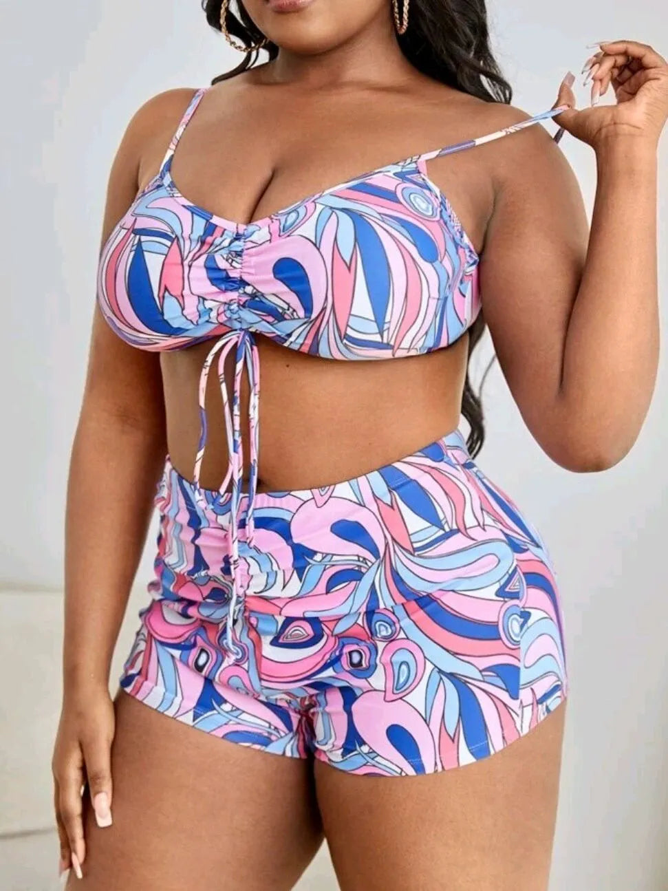 Women's floral print bikini set with underwire bra, high-waisted briefs, and a sheer cover-up cardigan.