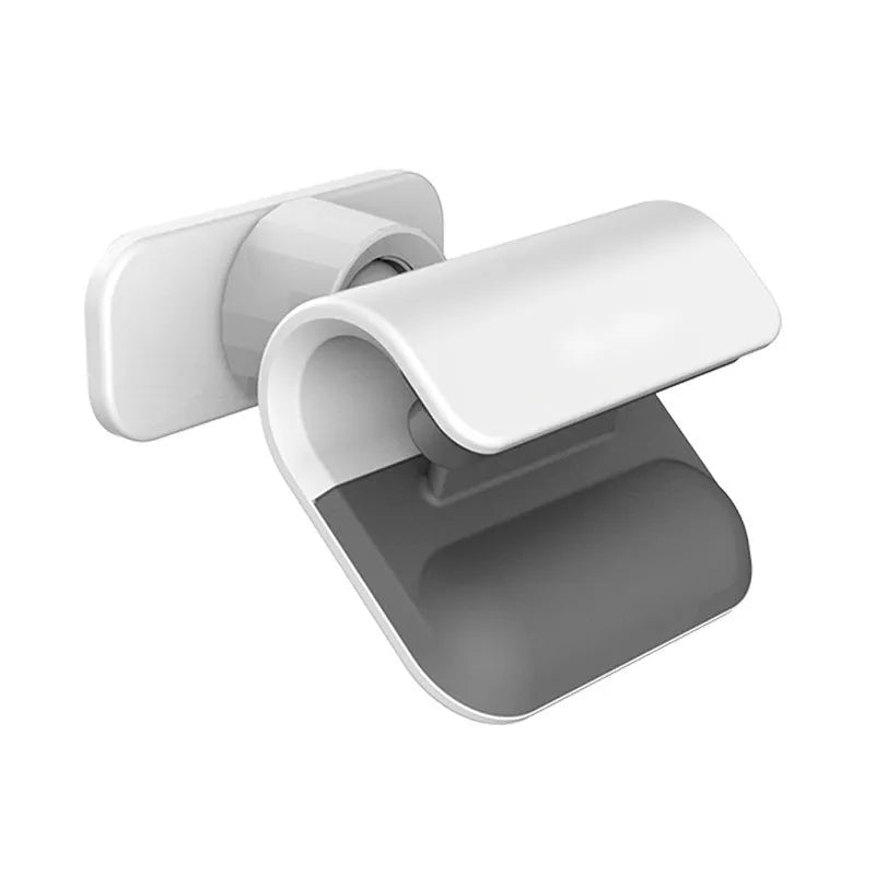 Black universal gravity car phone holder with 360-degree rotation on car dashboard