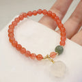 Women's red agate bracelet with 6mm beads and 8mm cat's paw design element