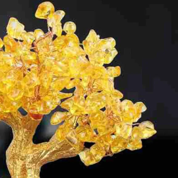 Citrine-coloured resin ornament of a turtle money tree in Chinese Feng Shui style.