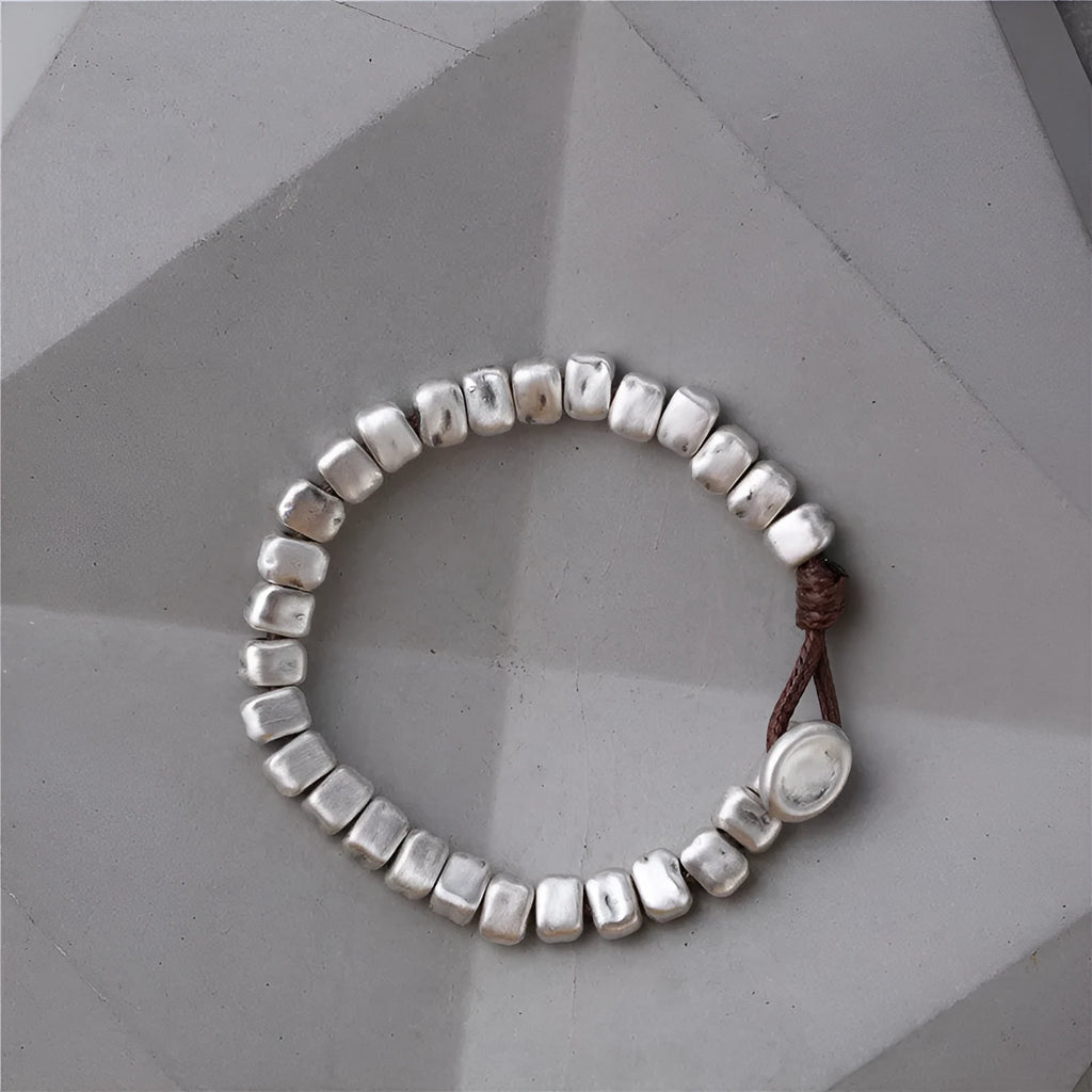 Women's handmade silver bracelet with irregular square design and elastic band