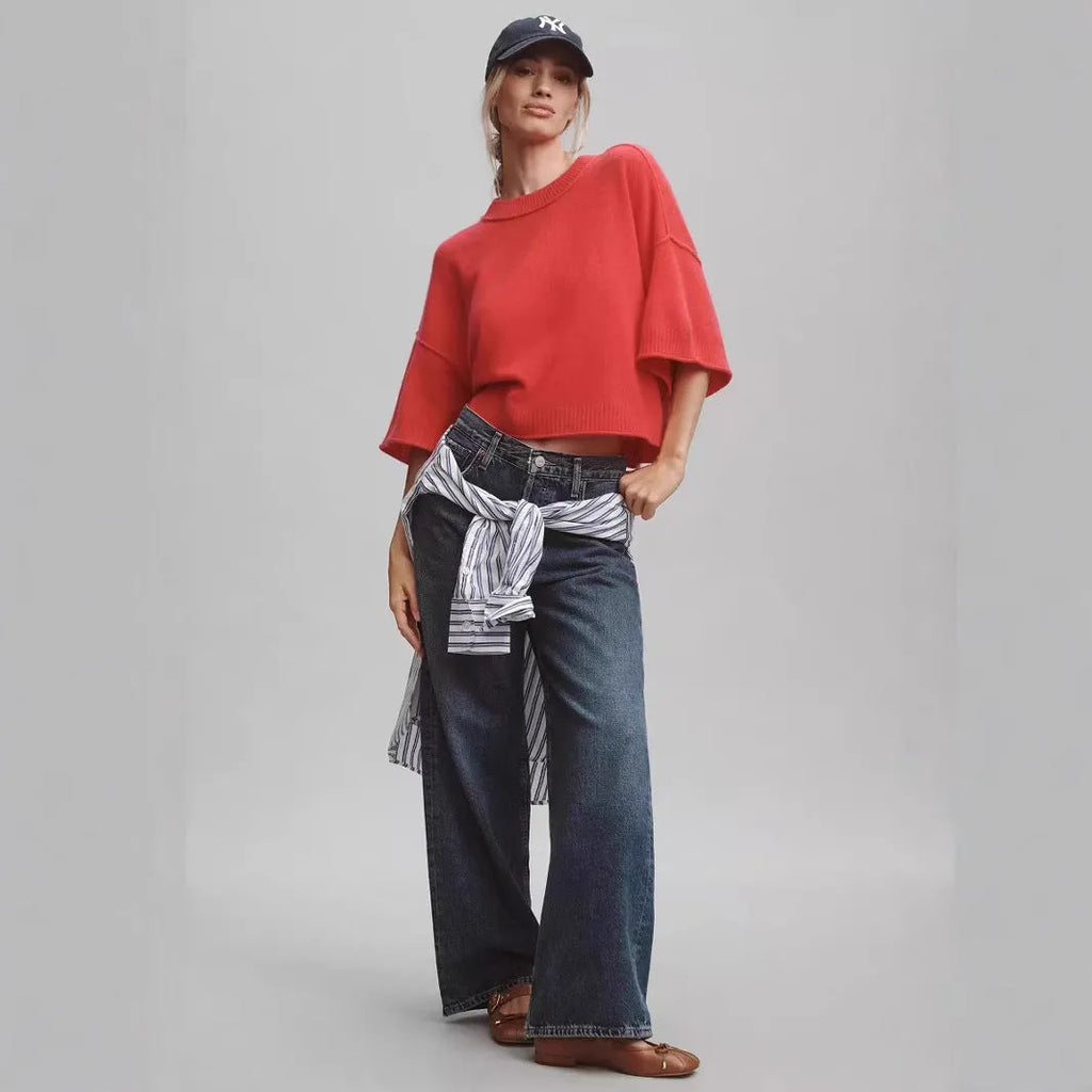 Red cropped women's t-shirt with regular sleeves and exposed navel styling on mannequin