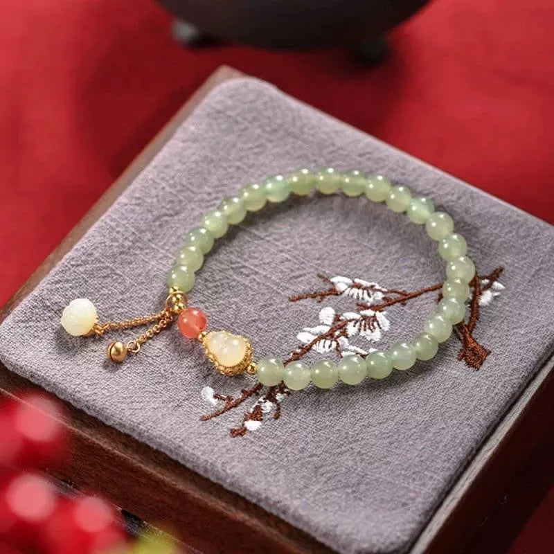 Qingshui jade women's bracelet with gold gourd design and fu character symbol