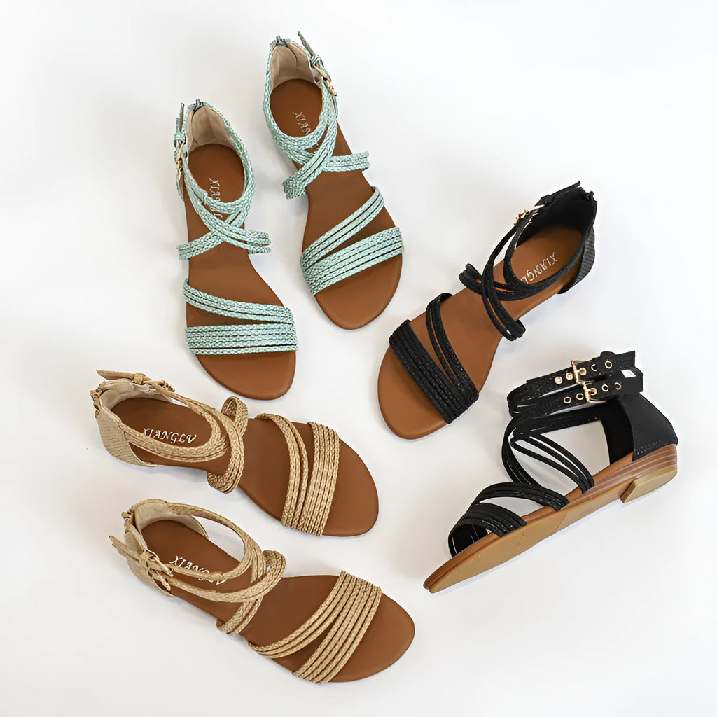 Women's open toe Roman sandals with cross strap, wedge heel, buckle, and back zipper in artificial leather.