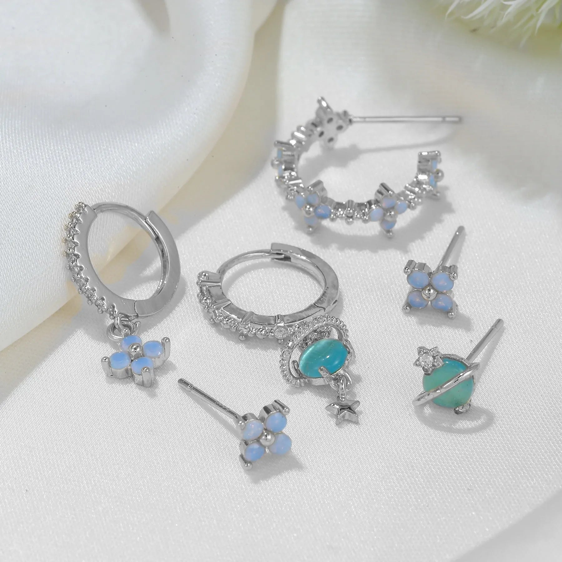 Gold and silver flower-shaped ear studs with zircon mosaic detail, Japanese Korean sweet girl style.