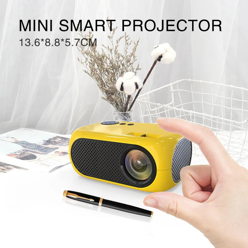 M24 micro mini portable LED projector in gold or white colour with power adapter and cables.