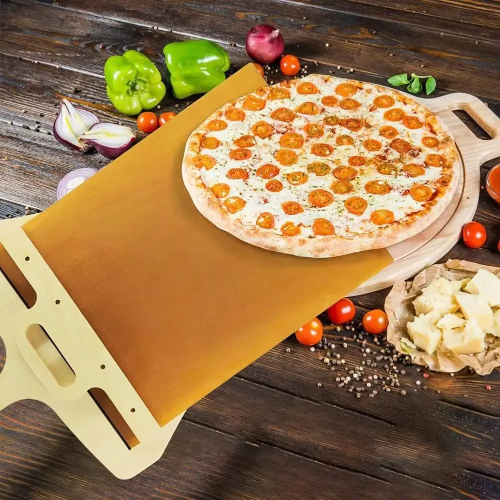 Wooden pizza shovel with cutting board surface and hanging hole at handle
