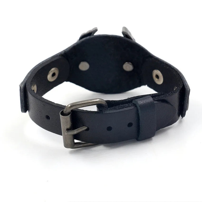 Black leather bracelet with geometric eagle watch-button clasp showing 26cm length and width variation
