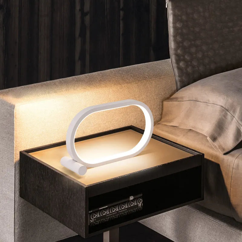USB plug-in oval acrylic night light with touch control, metal base, and dimmable LED in black
