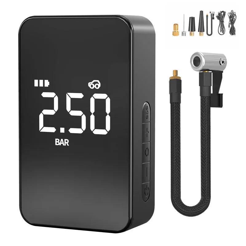 Small black wireless digital tyre inflator pump with screen, hose, and nozzles on a grey background.