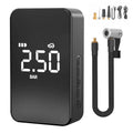 Small black wireless digital tyre inflator pump with screen, hose, and nozzles on a grey background.