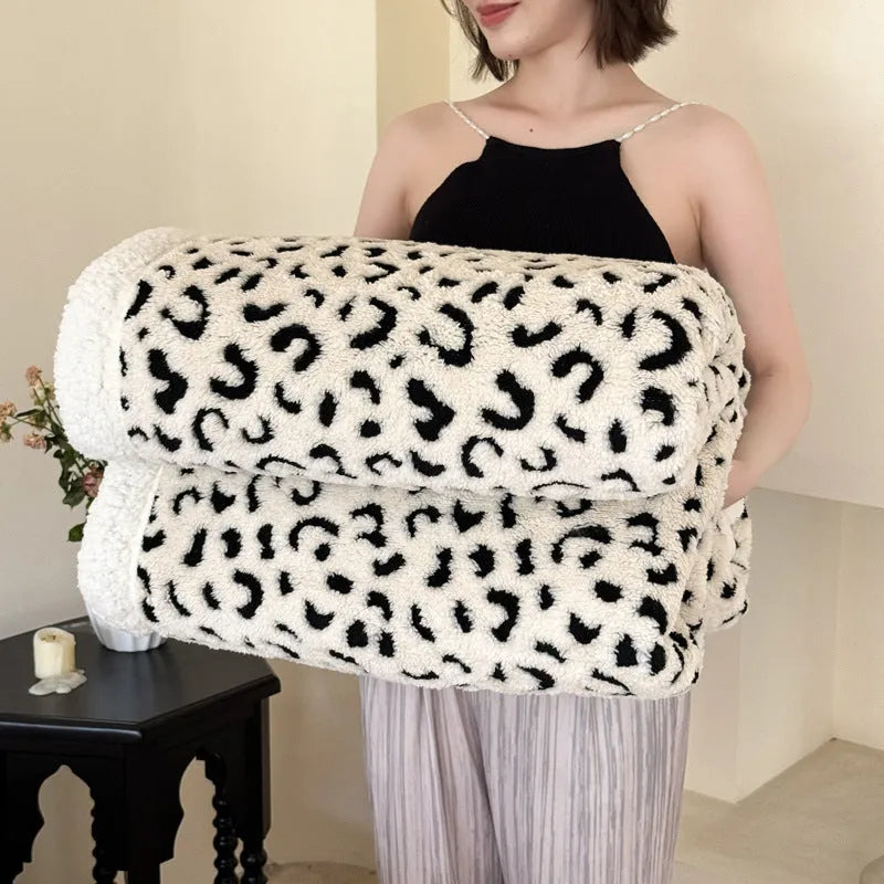 Double-layer cationic jacquard taffeta blanket with leopard print pattern in camel colour.