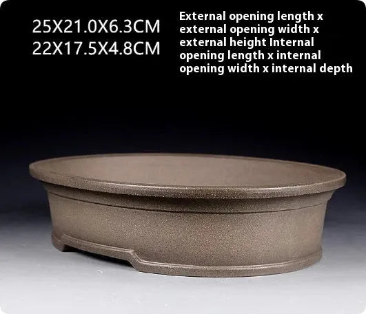Handmade antique oval bonsai flower pot in purple sand clay, showing its 25cm length and 6.3cm depth.
