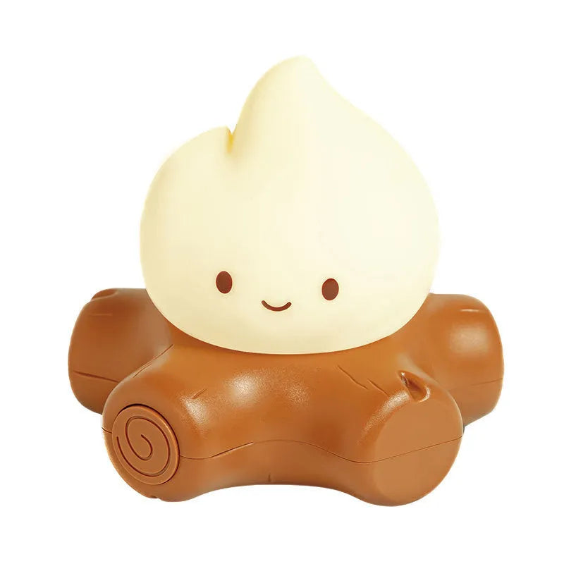 Small Fire Pile cartoon-style night lamp with yellow light on a surface.