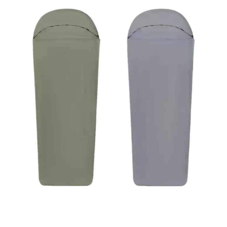 Blue mummy-style camping sleeping bag with tapered design on a green background.