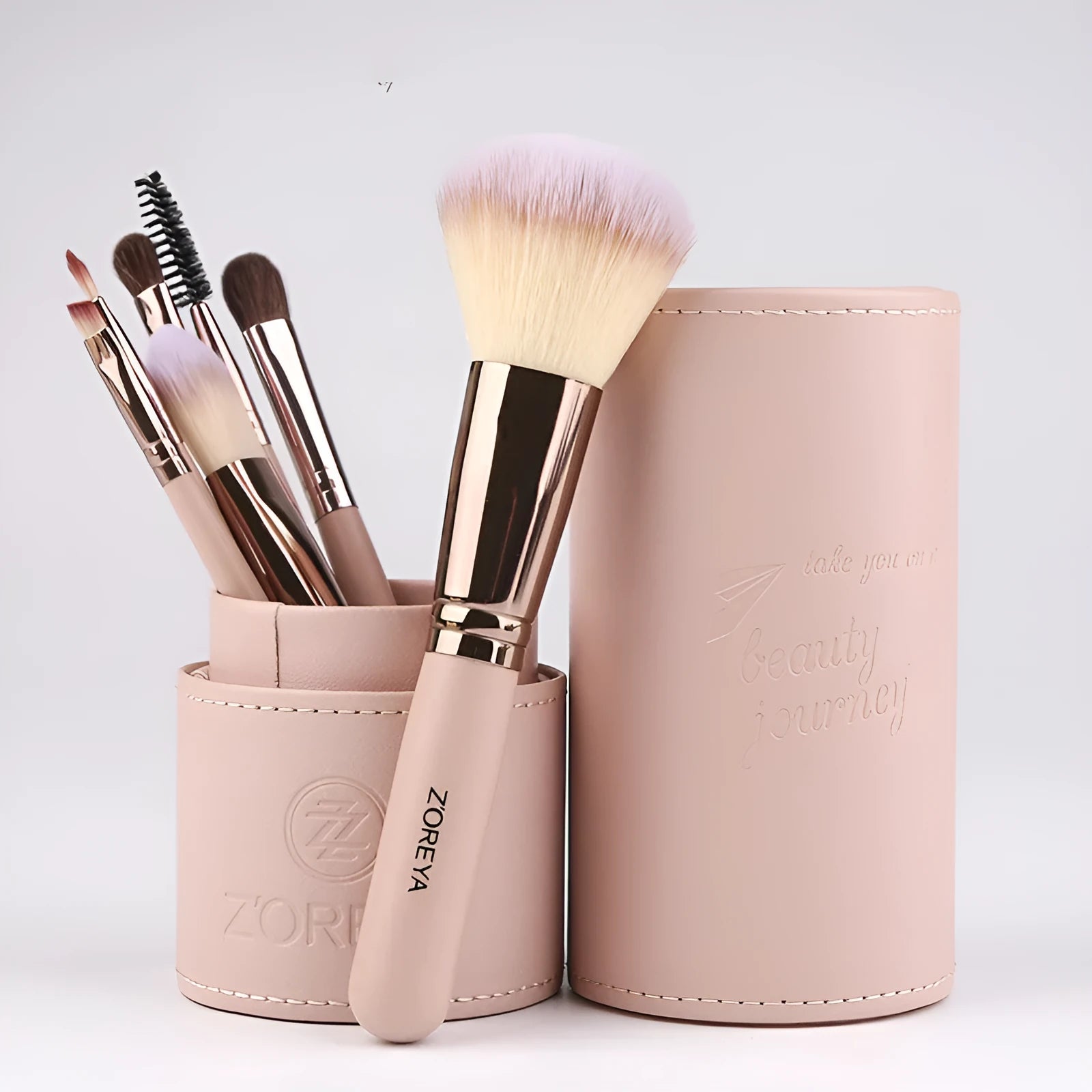 Daily makeup brush set with artificial fibre bristles and aluminium handles in black, brown, and pink