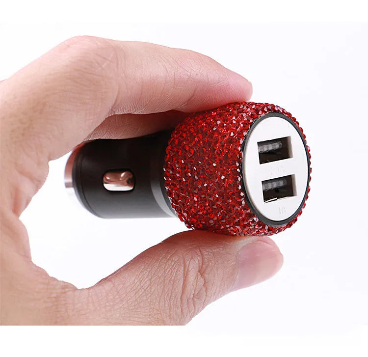 Dual USB car charger with diamond-pattern finish plugged into a car cigarette lighter socket
