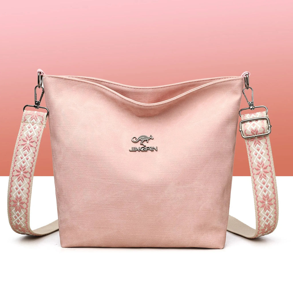 Soft PU leather women's crossbody bag in grey, pink, or yellow with an adjustable strap