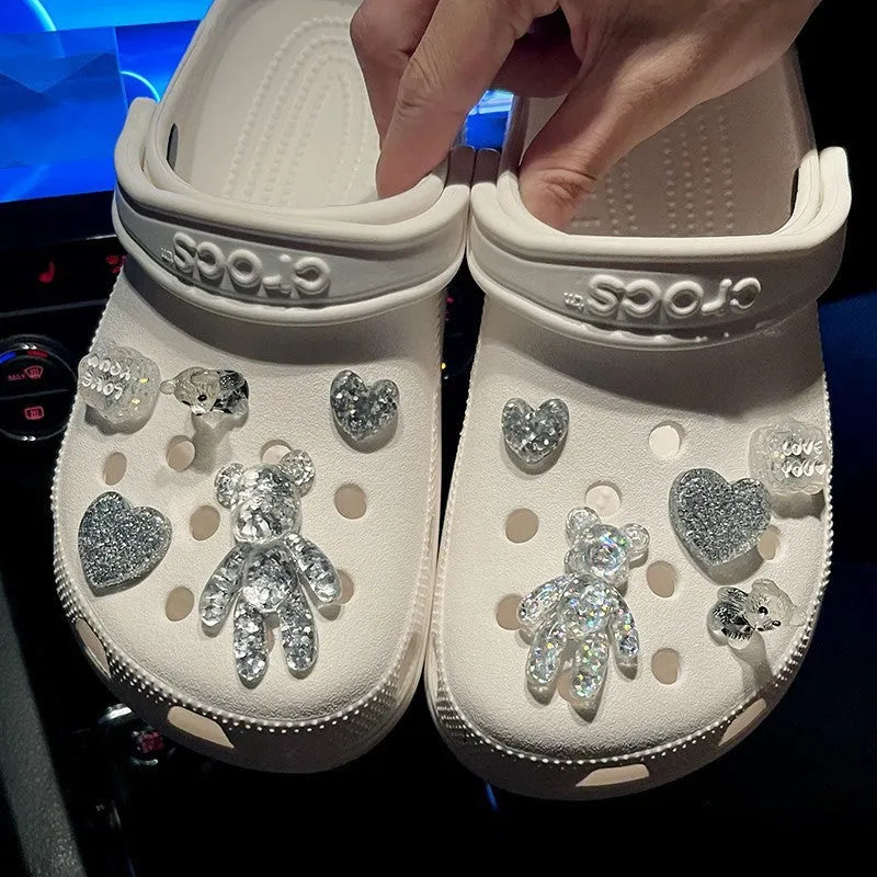 Crystal cloud bear shoe buckle set with resin, plush, and plastic details on a white background