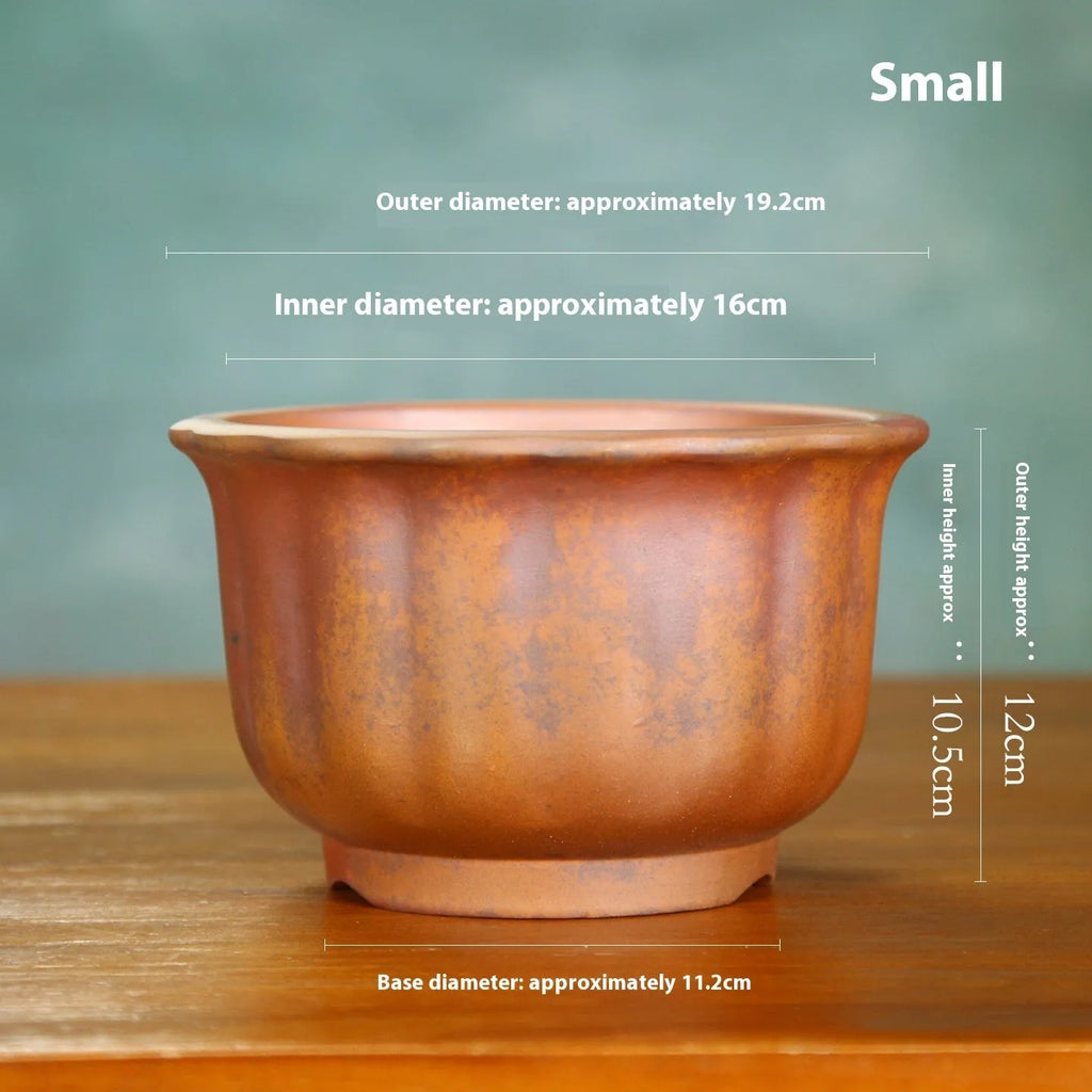 Antique carved purple sand ceramic bonsai pot in classical design for indoor plants.