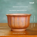 Antique carved purple sand ceramic bonsai pot in classical design for indoor plants.