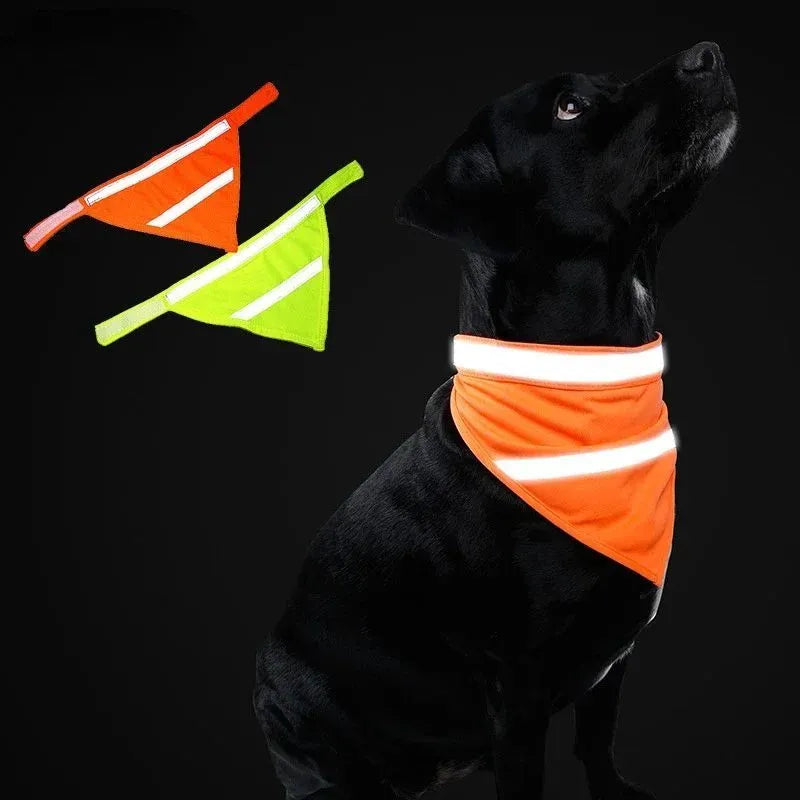 Yellow and orange reflective striped dog bandana scarf with adhesive strap closure on a dog's neck.