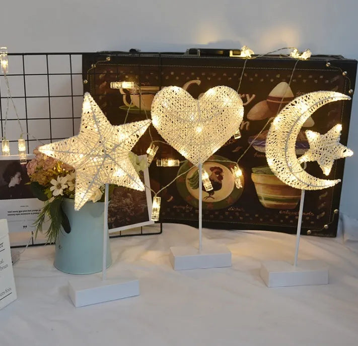 Rattan and copper wire LED table lamp in star, love heart, or moon shape for bedroom decoration.