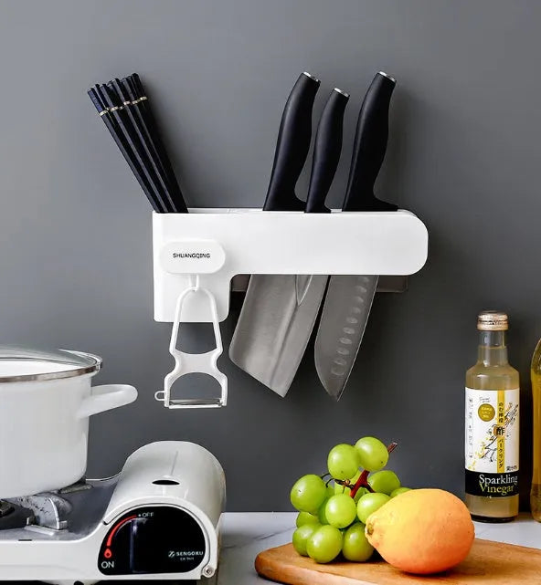 Modern white plastic kitchen knife storage rack with seven slots for organising cutlery