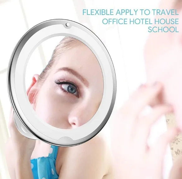 White 10x magnifying LED makeup mirror with gooseneck and suction base on a countertop
