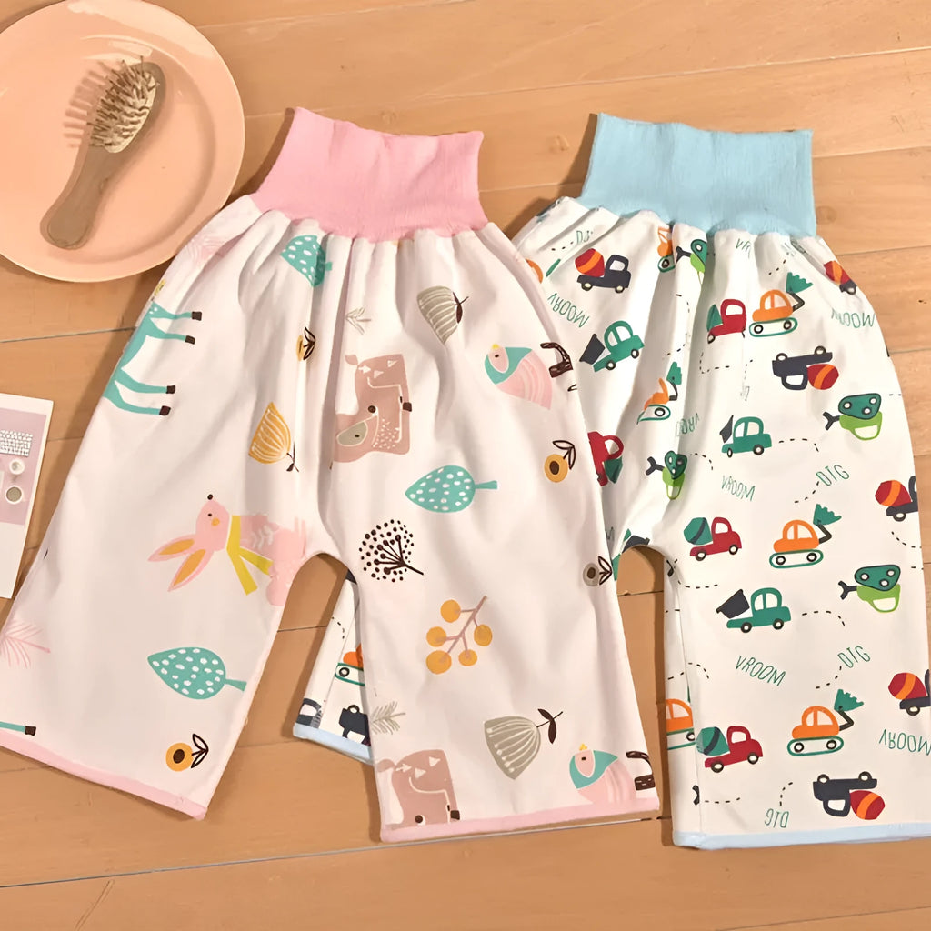 High waist baby diaper training pants in cotton bamboo fabric with cartoon print, showing wide elastic band.