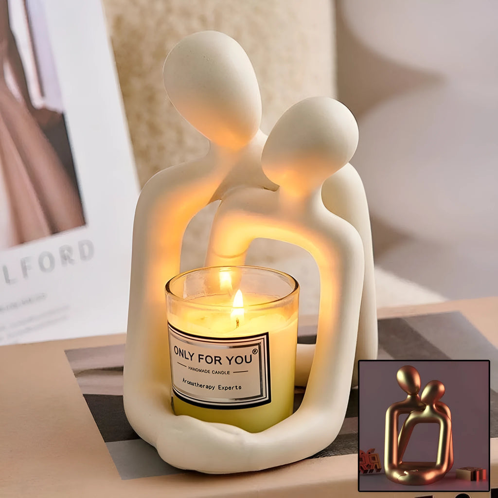 Modern minimalist loving couple resin statue in milky white or gold finish on wooden surface