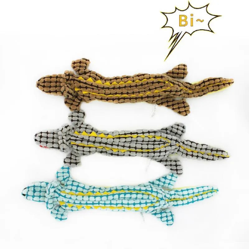 Blue corduroy plush crocodile dog toy with squeaker, shown next to a coffee-coloured large size version.