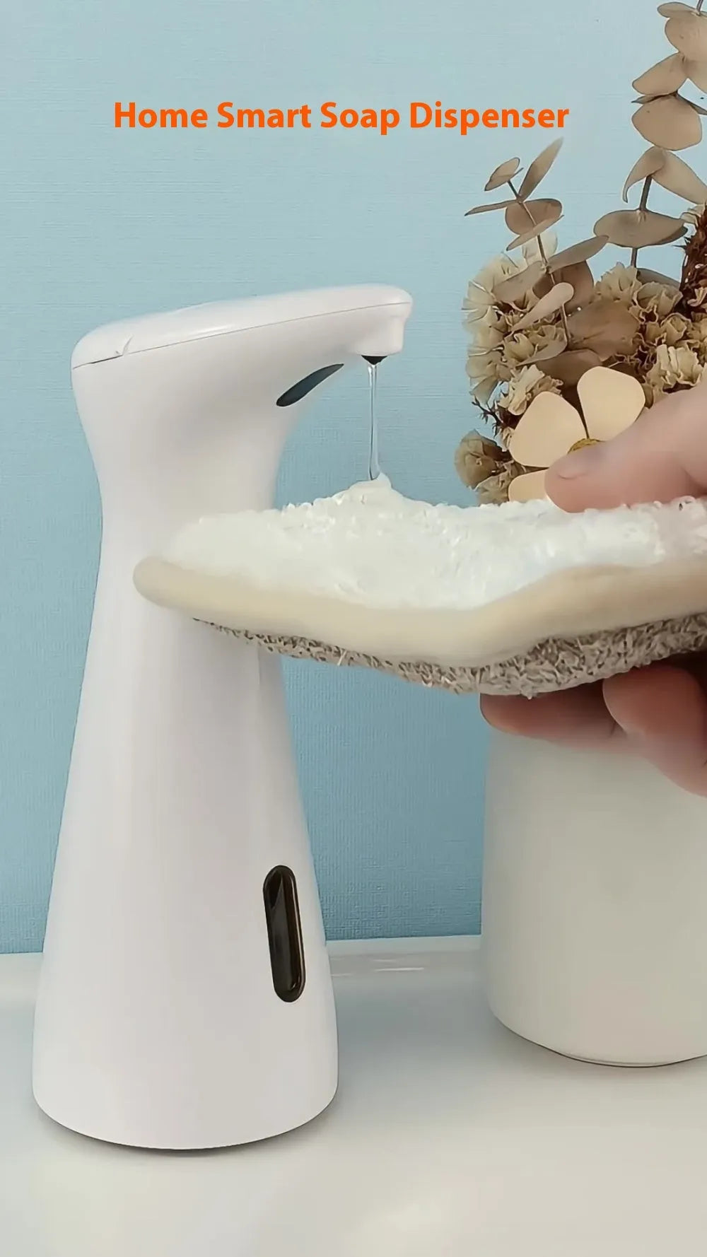 White infrared sensor automatic soap dispenser on a bathroom sink