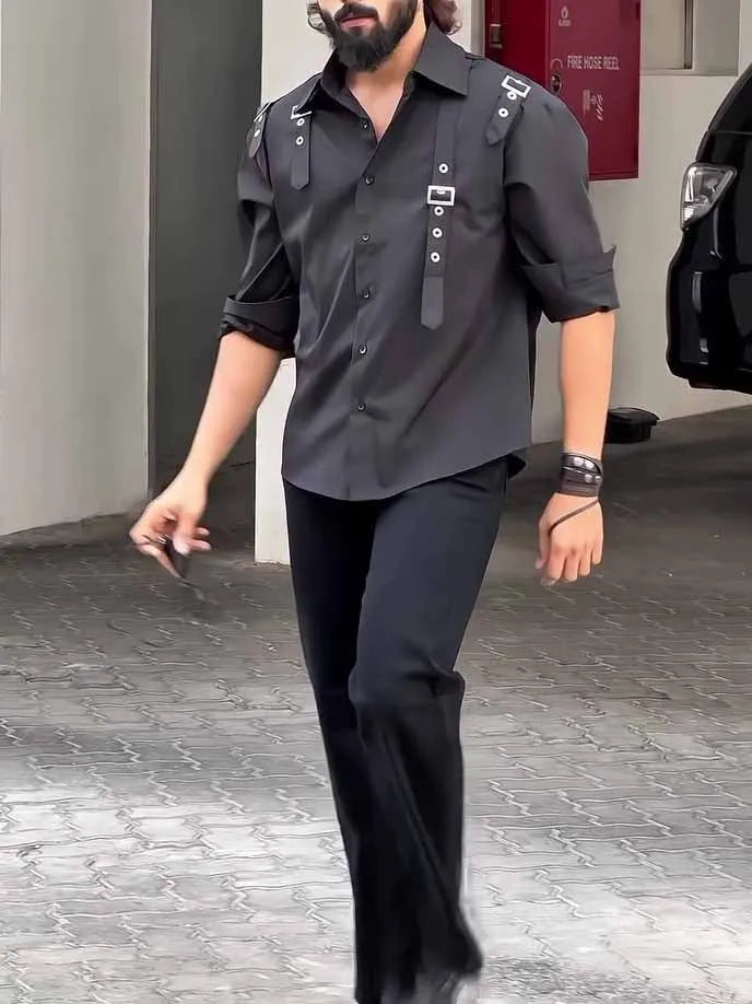 Man wearing a black utility-style button-up shirt with a regular fit.