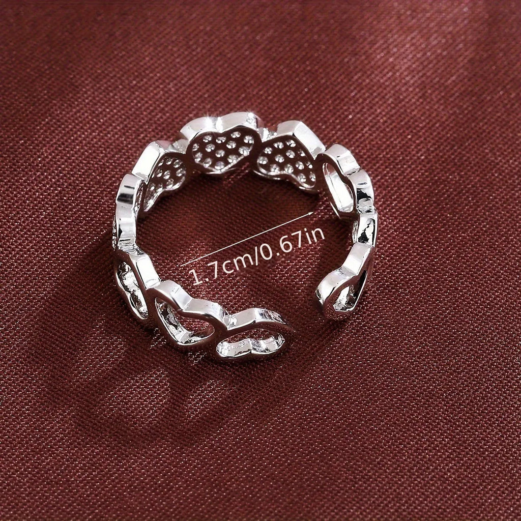 Adjustable copper couples ring with heart element in gold or silver colour