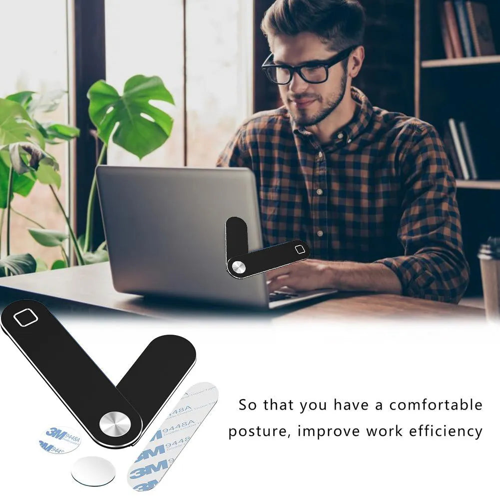 Black aluminium laptop phone holder clipped to side of monitor with smartphone attached.