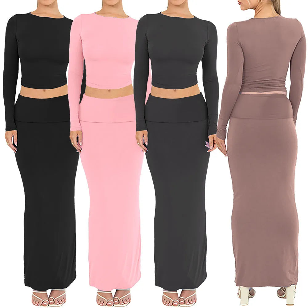 Women's black crop top and long skirt two-piece set with three-quarter sleeves and exposed navel design
