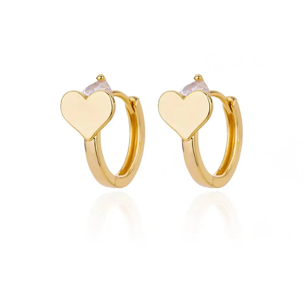 Gold-coloured heart-shaped clip-on stud earrings with a central zircon stone for women.
