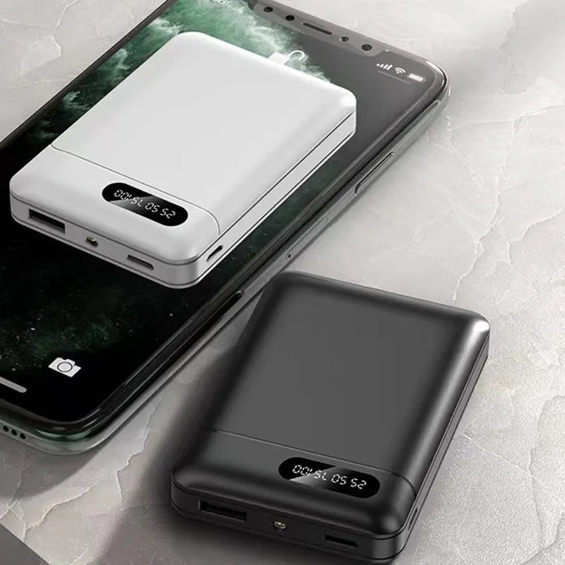 Black and white plastic power bank with dual USB ports showing 92x63x23mm dimensions